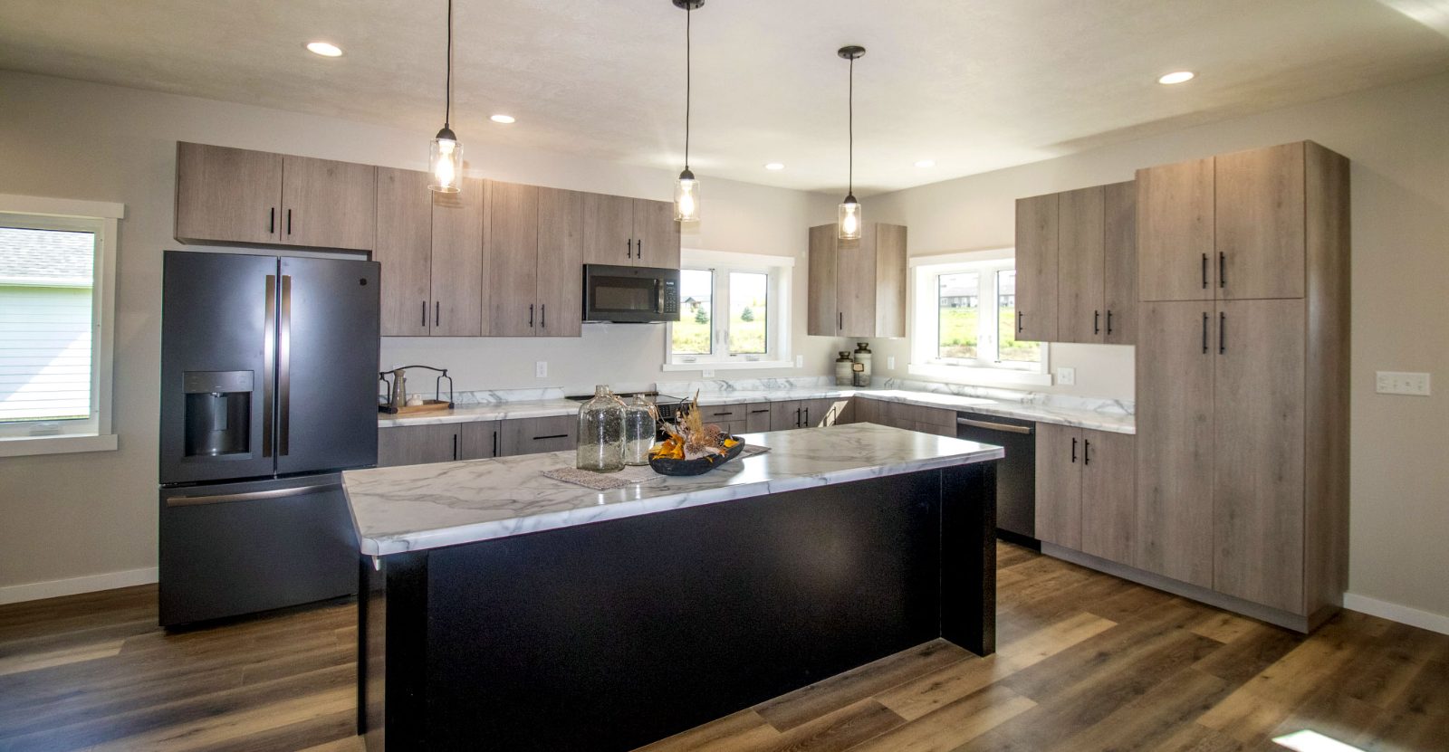 Modern open-concept barndominium kitchen and living interior